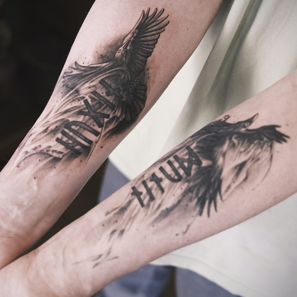 image of raven tattoos on forearms with rune lettering