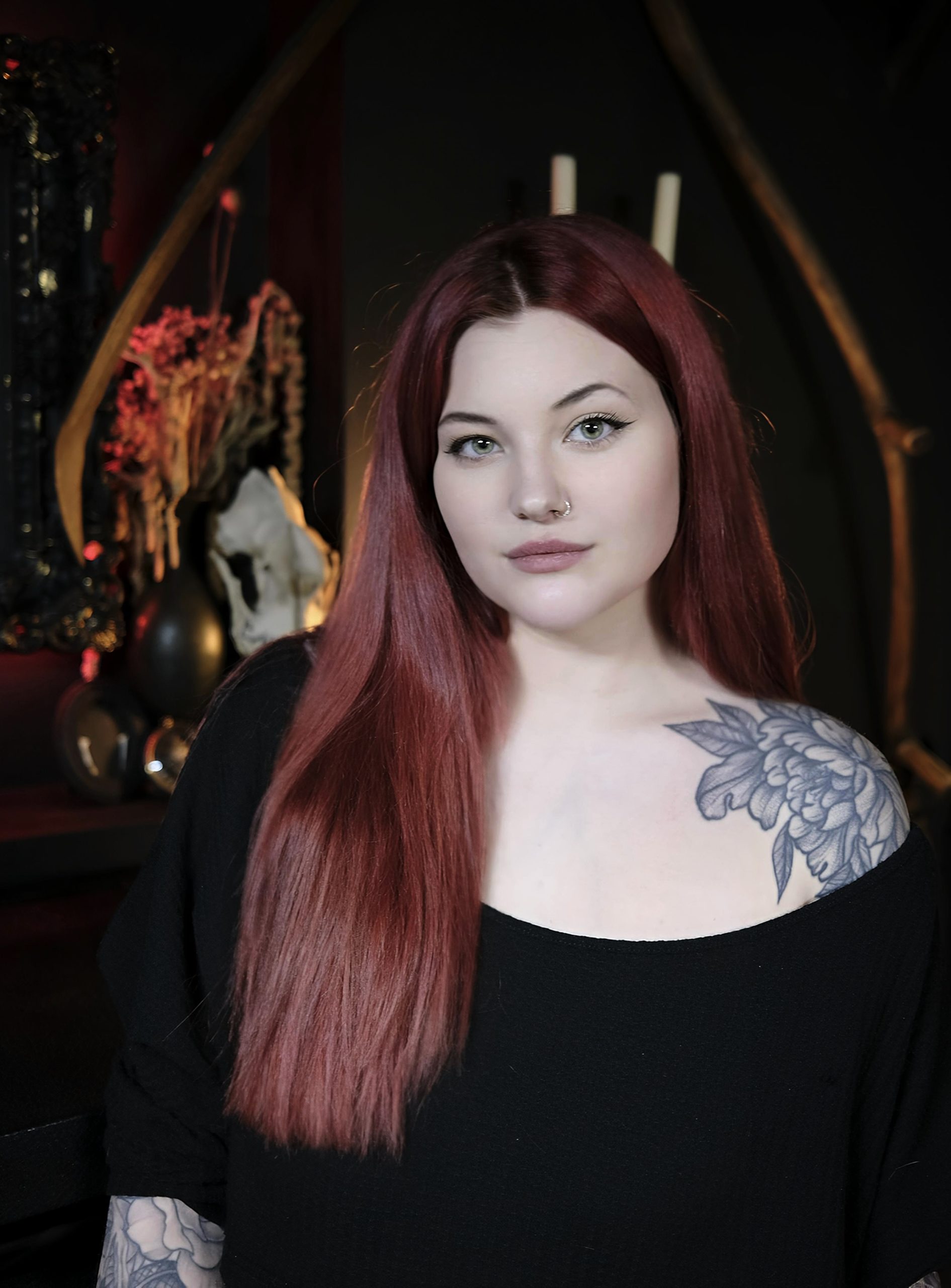 Image shows a portrait photograph of liv valentine tattoo artist in one for sorrow tattoo studio