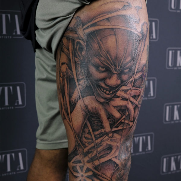 image of a thigh with large custom tattoo depicting the African god anansie