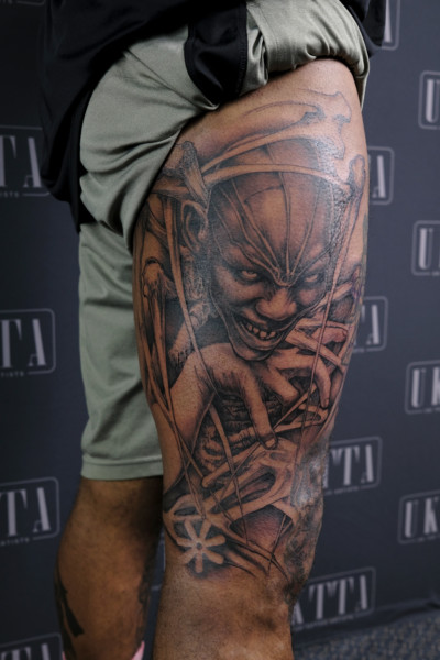 image of a thigh with large custom tattoo depicting the African god anansie