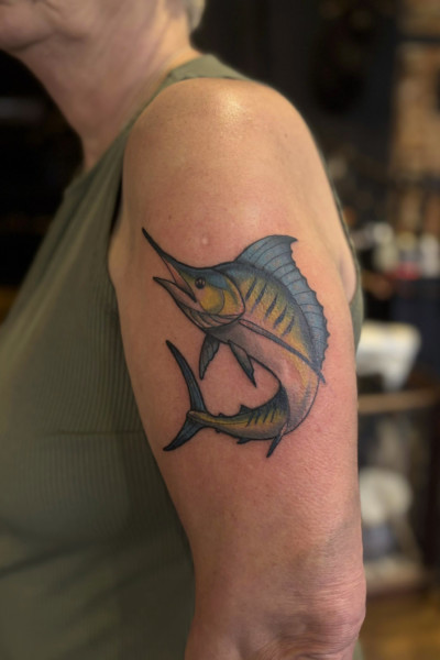 Marlin Photo of an arm tattoo featuring a full colour neo trad style marlin